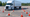 White semi-truck on a driving school course maneuvering around orange cones.