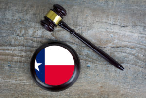 Wooden gavel with base with Texas flag on it